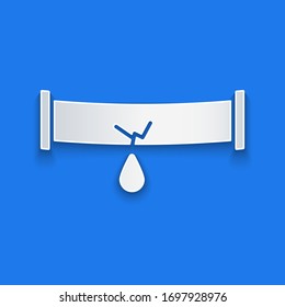 Paper cut Broken metal pipe with leaking water icon isolated on blue background. Paper art style. Vector Illustration