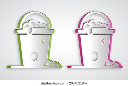 Paper cut Bucket with foam and bubbles icon isolated on grey background. Cleaning service concept. Paper art style. Vector