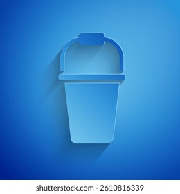 Paper cut Bucket icon isolated on blue background. Paper art style. Vector