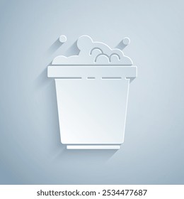 Paper cut Bucket with soap suds icon isolated on grey background. Bowl with water. Washing clothes, cleaning equipment. Paper art style. Vector Illustration