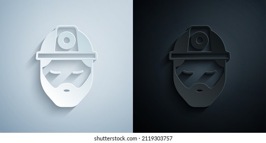 Paper cut Builder icon isolated on grey and black background. Construction worker. Paper art style. Vector