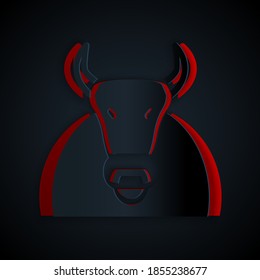 Paper cut Bull icon isolated on black background. Spanish fighting bull. Paper art style. Vector.
