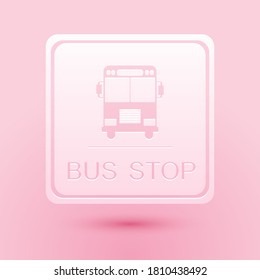 Paper cut Bus stop icon isolated on pink background. Paper art style. Vector.