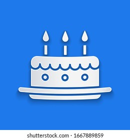 Paper cut Cake with burning candles icon isolated on blue background. Happy Birthday. Paper art style. Vector Illustration