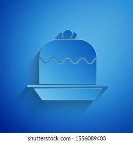Paper cut Cake icon isolated on blue background. Happy Birthday. Paper art style. Vector Illustration