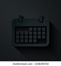 Paper cut Calendar icon isolated on black background. Paper art style. Vector Illustration