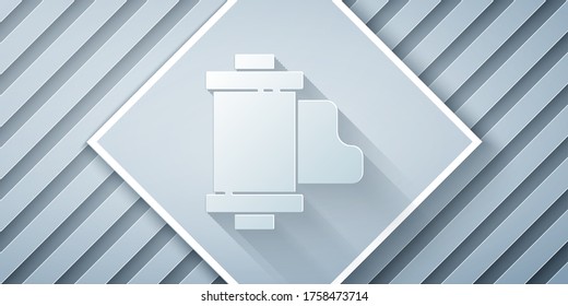 Paper cut Camera vintage film roll cartridge icon isolated on grey background. 35mm film canister. Filmstrip photographer equipment. Paper art style. Vector Illustration