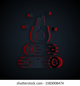 Paper cut Campfire icon isolated on black background. Burning bonfire with wood. Paper art style. Vector Illustration