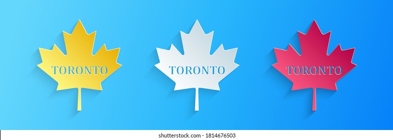 Paper cut Canadian maple leaf with city name Toronto icon isolated on blue background. Paper art style. Vector.