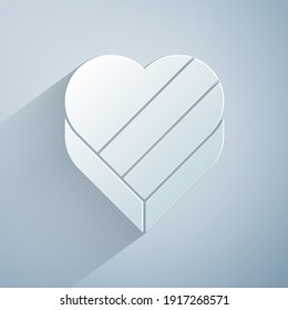 Paper cut Candy in heart shaped box and bow icon isolated on grey background. Valentines Day. Paper art style. Vector