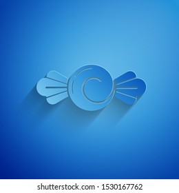 Paper cut Candy icon isolated on blue background. Happy Halloween party. Paper art style. Vector Illustration