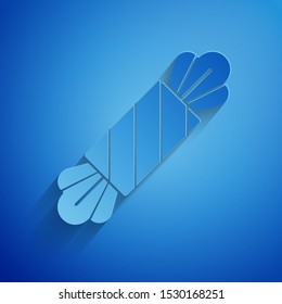 Paper cut Candy icon isolated on blue background. Happy Halloween party. Paper art style. Vector Illustration