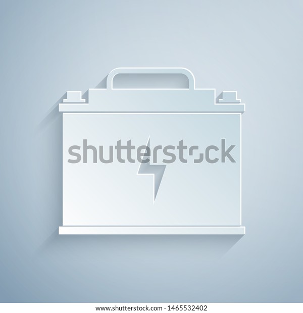 Paper cut Car\
battery icon isolated on grey background. Accumulator battery\
energy power and electricity accumulator battery. Lightning bolt.\
Paper art style. Vector\
Illustration