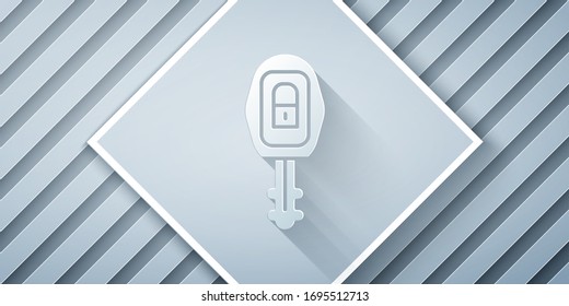 Paper cut Car key with remote icon isolated on grey background. Car key and alarm system. Paper art style. Vector Illustration