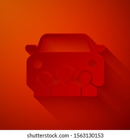Paper cut Car sharing with group of people icon isolated on red background. Carsharing sign. Transport renting service concept. Paper art style. Vector Illustration