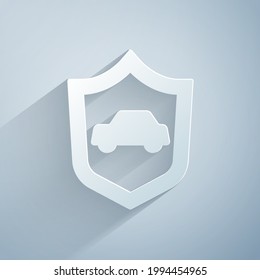 Paper cut Car with shield icon isolated on grey background. Insurance concept. Security, safety, protection, protect concept. Paper art style. Vector