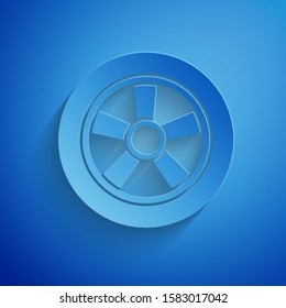 Paper cut Car wheel icon isolated on blue background. Paper art style. Vector Illustration