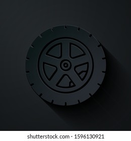 Paper cut Car wheel icon isolated on black background. Paper art style. Vector Illustration