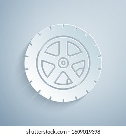 Paper cut Car wheel icon isolated on grey background. Paper art style. Vector Illustration