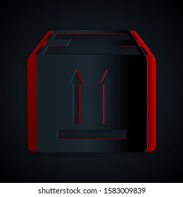 Paper cut Cardboard box with traffic symbol icon isolated on black background. Box, package, parcel sign. Delivery, transportation and shipping. Paper art style. Vector Illustration