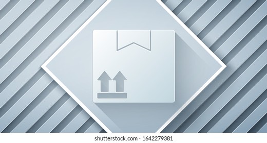 Paper cut Cardboard box with traffic symbol icon isolated on grey background. Box, package, parcel. Delivery, transportation and shipping. Paper art style. Vector Illustration