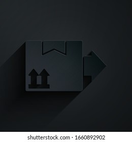 Paper cut Cardboard box with traffic symbol icon isolated on black background. Box, package, parcel. Delivery, transportation and shipping. Paper art style. Vector Illustration