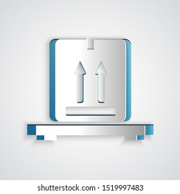 Paper cut Cardboard boxes on pallet icon isolated on grey background. Closed carton delivery packaging box with fragile signs. Paper art style. Vector Illustration