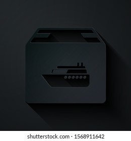 Paper cut Cargo ship with boxes delivery service icon isolated on black background. Delivery, transportation. Freighter with parcels, boxes, goods. Paper art style. Vector Illustration
