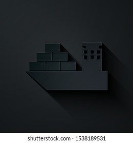 Paper cut Cargo ship icon isolated on black background. Paper art style. Vector Illustration