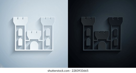 Paper cut Castle icon isolated on grey and black background. Medieval fortress with a tower. Protection from enemies. Reliability and defense of the city. Paper art style. Vector