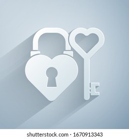 Paper cut Castle in the shape of a heart and key in heart shape icon isolated on grey background. Love symbol and keyhole sign. Paper art style. Vector Illustration