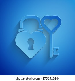 Paper cut Castle in the shape of a heart and key in heart shape icon isolated on blue background. Love symbol and keyhole sign. Paper art style. Vector Illustration