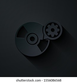 Paper cut CD or DVD disk and gear icon isolated on black background. Adjusting app, service concept, setting options, maintenance, repair, fixing. Paper art style. Vector Illustration