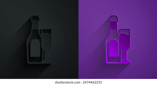 Paper cut Champagne bottle with glass icon isolated on black on purple background. Paper art style. Vector