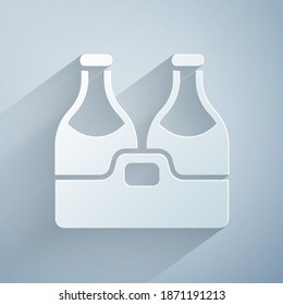 Paper cut Champagne bottle icon isolated on grey background. Merry Christmas and Happy New Year. Paper art style. Vector