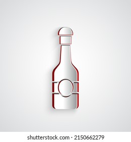 Paper cut Champagne bottle icon isolated on grey background. Merry Christmas and Happy New Year. Paper art style. Vector