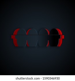 Paper cut Chicken egg in box icon isolated on black background. Paper art style. Vector Illustration
