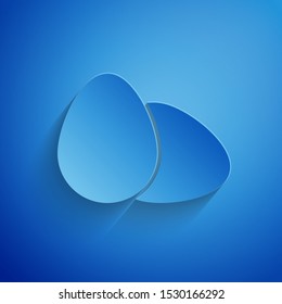 Paper cut Chicken egg icon isolated on blue background. Paper art style. Vector Illustration
