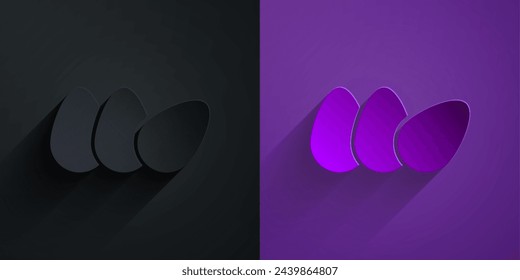 Paper cut Chicken egg icon isolated on black on purple background. Paper art style. Vector