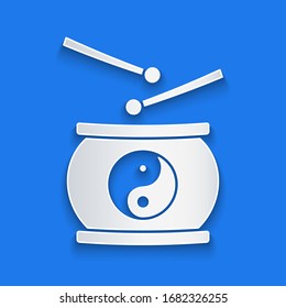 Paper cut Chinese drum icon isolated on blue background. Traditional asian percussion instrument Taiko or O-Daiko drum. Paper art style. Vector Illustration