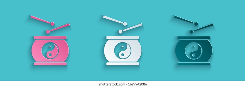 Paper cut Chinese drum icon isolated on blue background. Traditional asian percussion instrument Taiko or O-Daiko drum. Paper art style. Vector Illustration