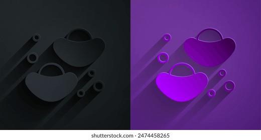 Paper cut Chinese fortune cookie icon isolated on black on purple background. Asian traditional. Paper art style. Vector
