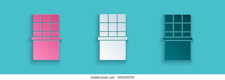 Paper cut Chocolate bar icon isolated on blue background. Paper art style. Vector