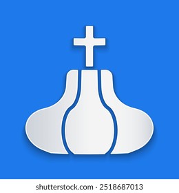 Paper cut Christian church tower icon isolated on blue background. Religion of church. Paper art style. Vector