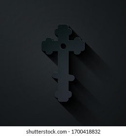 Paper cut Christian cross icon isolated on black background. Church cross. Paper art style. Vector Illustration