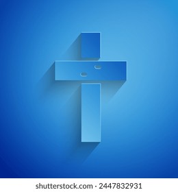 Paper cut Christian cross icon isolated on blue background. Church cross. Paper art style. Vector
