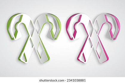 Paper cut Christmas candy cane with stripes icon isolated on grey background. Merry Christmas and Happy New Year. Paper art style. Vector
