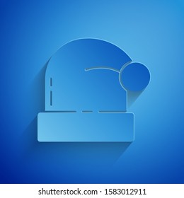 Paper cut Christmas Santa Claus hat icon isolated on blue background. Merry Christmas and Happy New Year. Paper art style. Vector Illustration