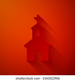 Paper cut Church building icon isolated on red background. Christian Church. Religion of church. Paper art style. Vector Illustration