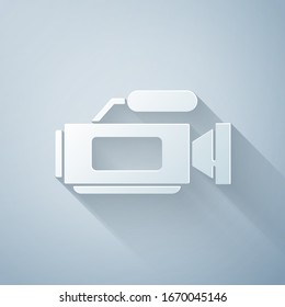 Paper cut Cinema camera icon isolated on grey background. Video camera. Movie sign. Film projector. Paper art style. Vector Illustration